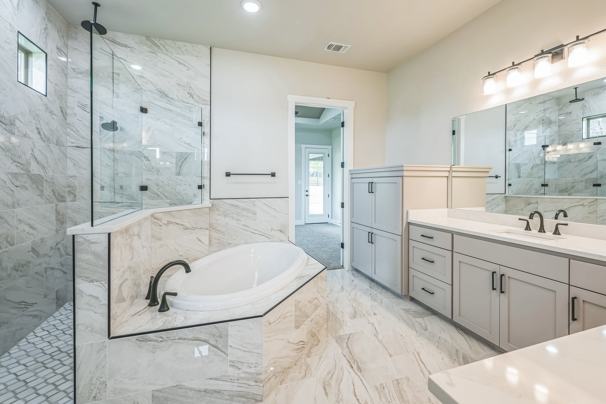 Carothers primary bathroom with granite vanity