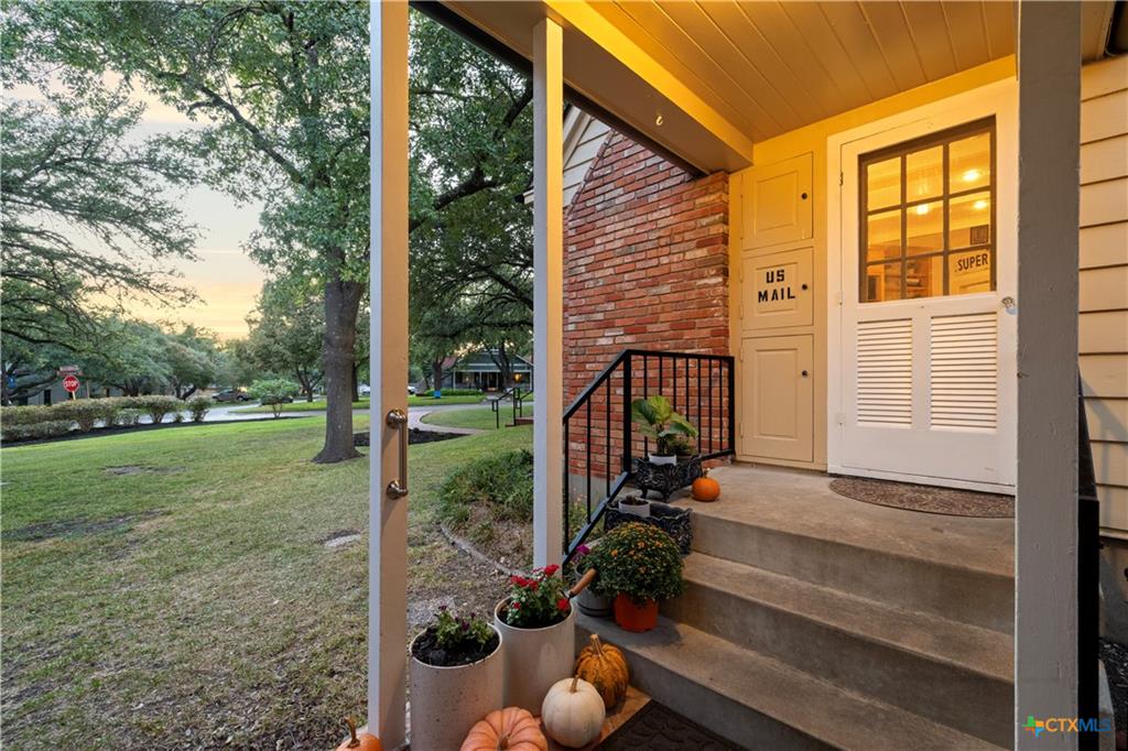 Front yard of a historic home in the North Central Temple Historic District showing mature landscaping and period architecture