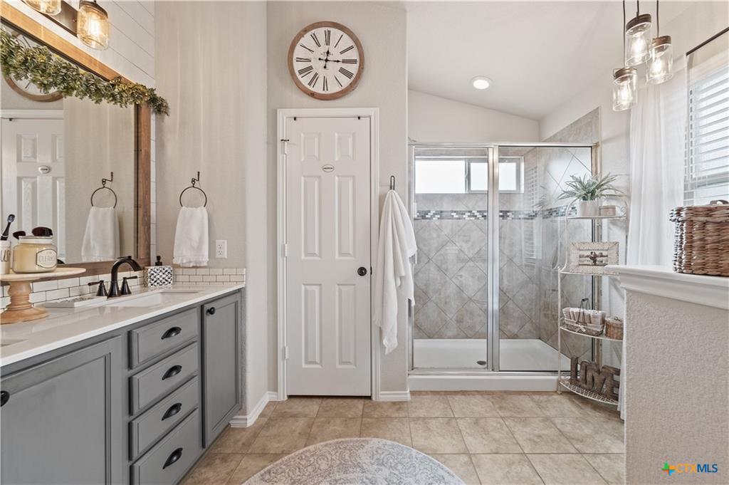 Master bathroom with double vanity in Alta Vista home