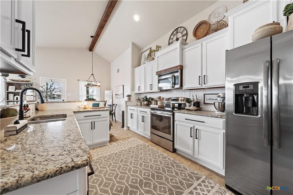 Open-concept kitchen with island in an Alta Vista Temple TX home