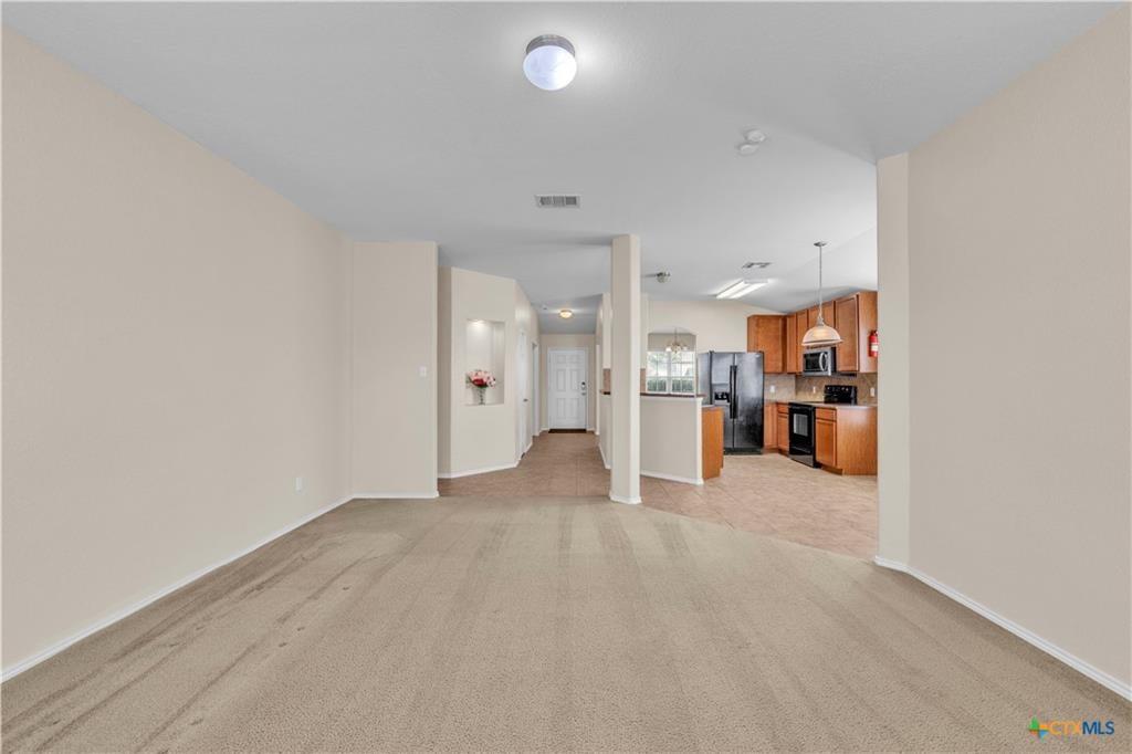 Living room interior with vaulted ceiling in Windmill Farms, Temple TX