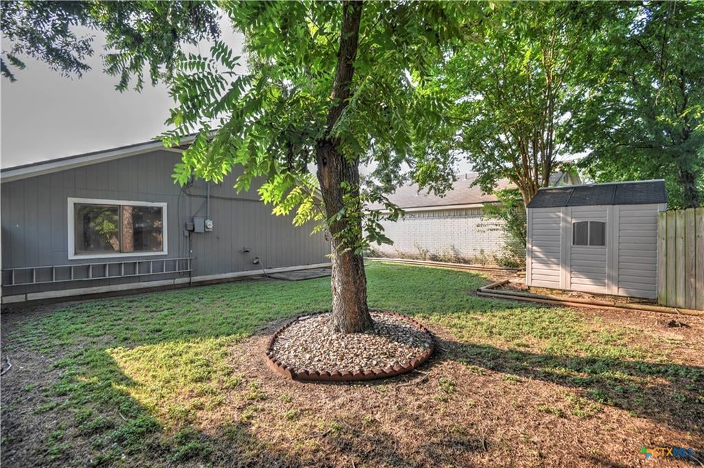 Cimmaron backyard with fence and mature trees