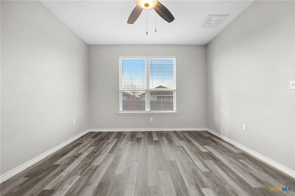 7713 Purvis primary bedroom — natural light, neutral palette