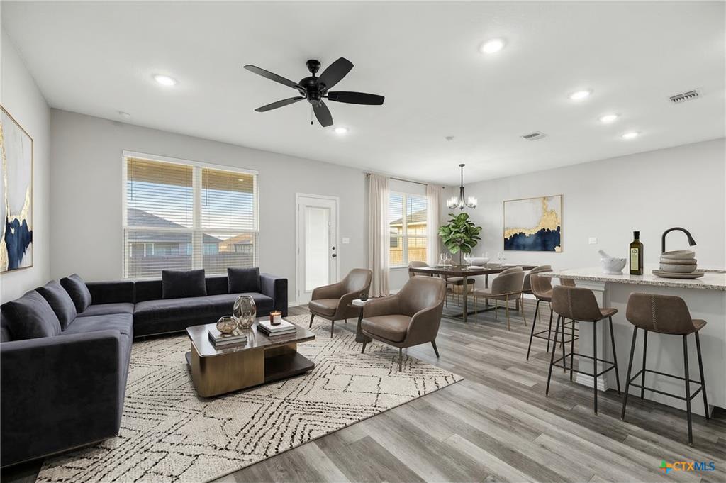 7713 Purvis staged living room — professional photography after relisting