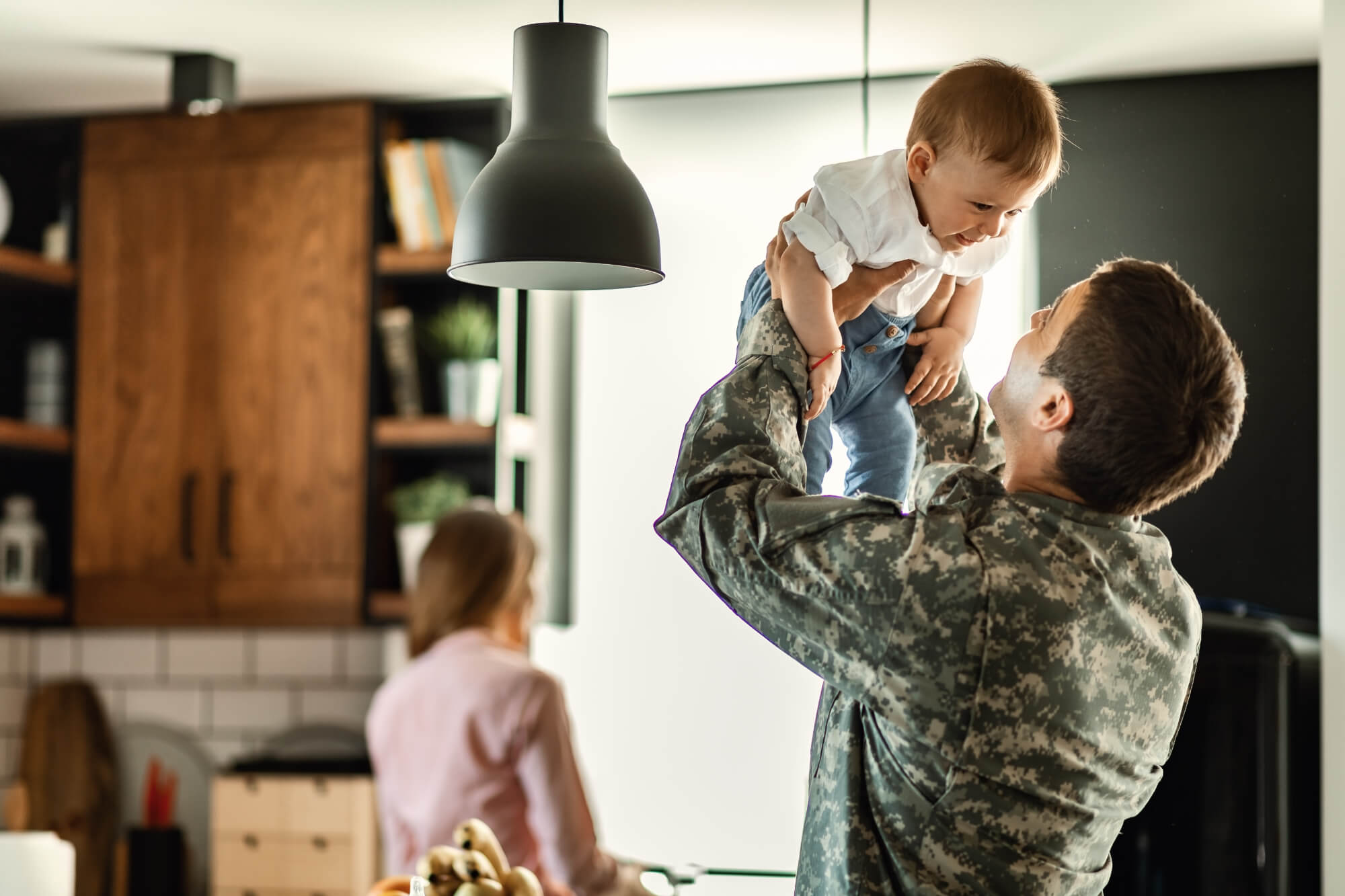 soldier-holding-smiling-baby
