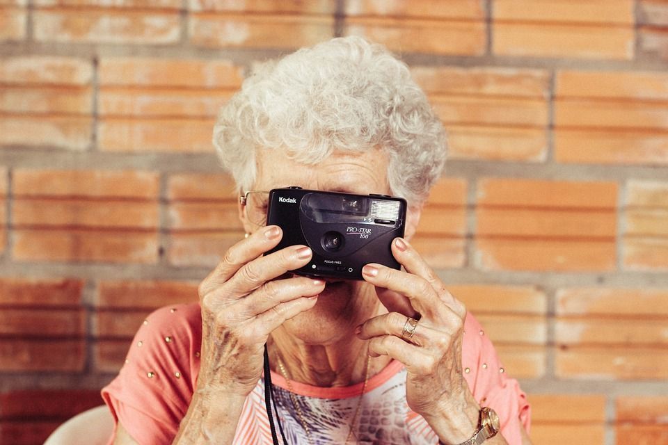 grandmother renting while taking a picture