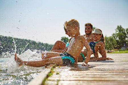 Happy-family-at-a-lake-having-fun