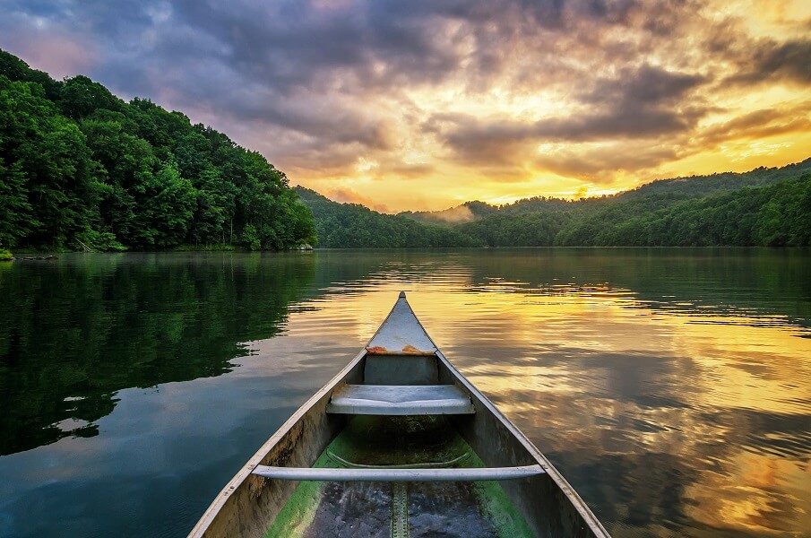 A dramatic sunset from an old canoe