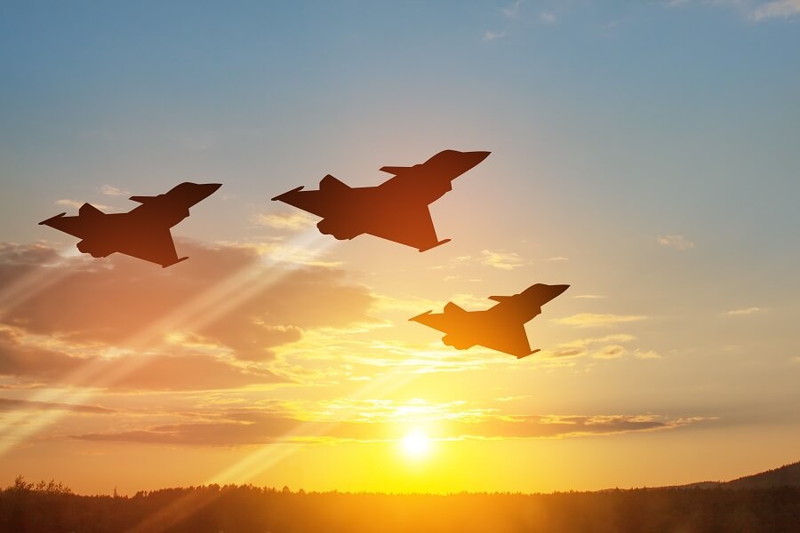 Aircraft silhouettes on background of sunset
