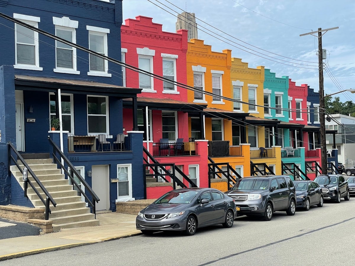 Colorful row houses on a Pittsburgh neighborhood street