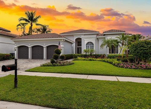 Facade of an elegant house with gray walls with white details