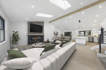 open concept living room with vaulted ceilings in oradell nj