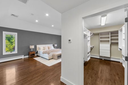 30 the larger of 2 primary closets