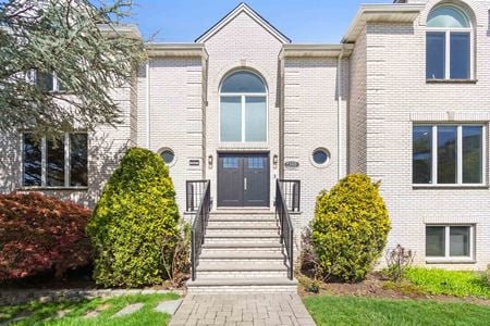 8 Double front entry doors at a mansion in Fort Lee