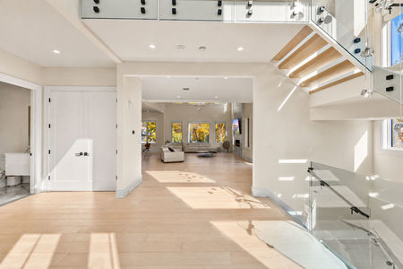 8 Entry Foyer w Floating Staircase