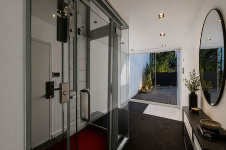 14-31 Casta Modern hallway with sleek elevator and decor