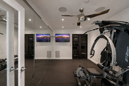 16-31 Casta Modern home gym with AV setup