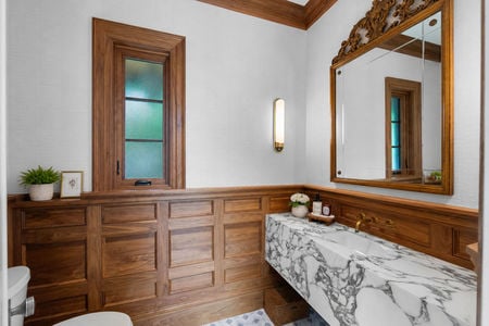23 548 Sylvan Pl Elegant bathroom with wood and marble accents