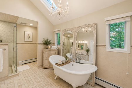 32. 18 Monument Elegant spa bathroom with vintage accents