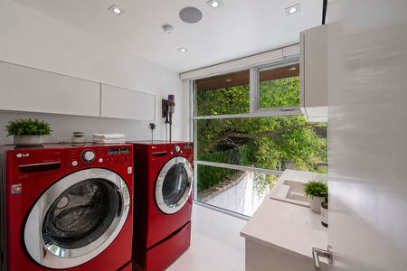 38-31 Casta Modern laundry room with red appliances