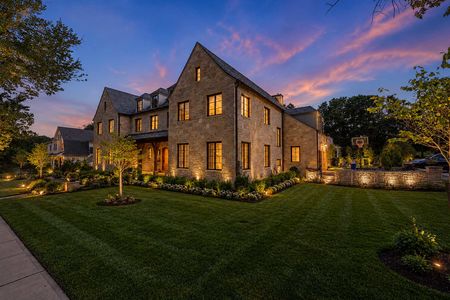 4 548 Sylvan Pl Twilight glow on a classic stone home