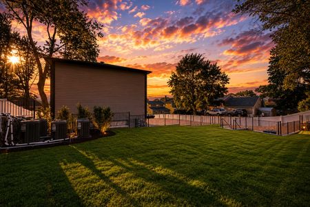 48. 401 Grand Ave. Golden hour in a suburban backyard