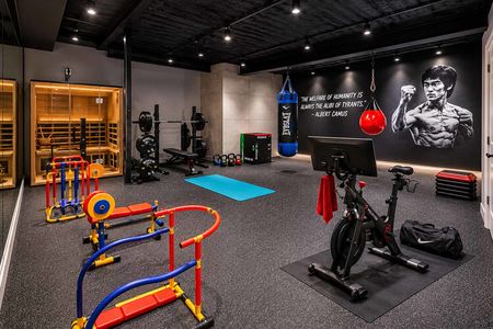 49 548 Sylvan Pl Modern gym with high-contrast lighting