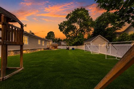 5 14 Morrow Midland Park Backyard sunset with playset and lights
