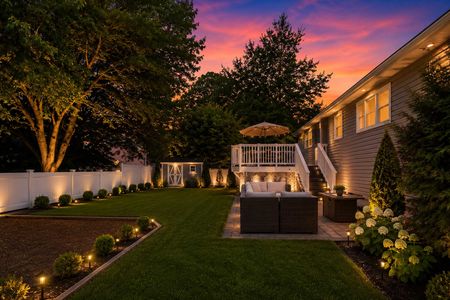 5 34 Middletown Montvale Serene backyard at twilight with warm lights