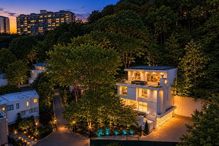59-31 Casta Twilight view of a modern hillside home