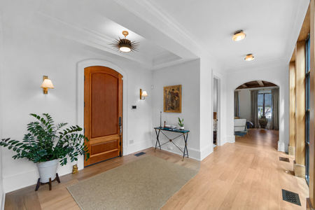 8 548 Sylvan Pl Elegant foyer with arched wooden doors