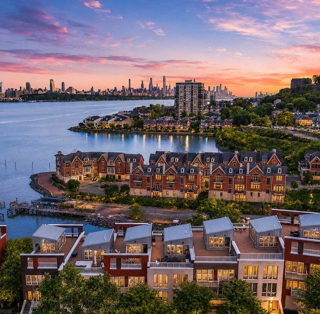 Vela Twilight over a calm waterfront cityscape