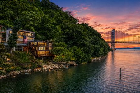 10. 35 Shore Sunset over riverfront homes and bridge
