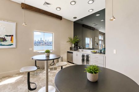 12. 26 Ave Port Imperial Modern kitchenette with city views