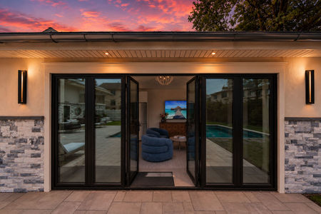 13. 35 Jane Modern house at sunset with open doors
