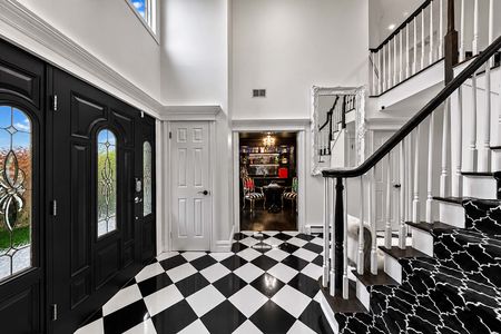 13. 5 Gates Pl. Elegant foyer with black-and-white accents