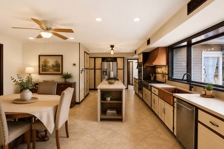 13. 933 River Rd. Warm modern kitchen with dining area