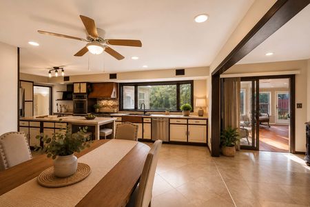 14. 933 River Rd. Cozy kitchen-dining with sunroom view