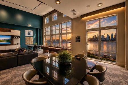 15. 26 Ave Port Imperial Modern lounge with sunset city view