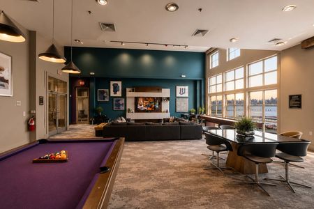 16. 26 Ave Port Imperial Modern lounge with waterfront sunset views