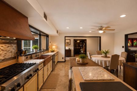 18. 933 River Rd. Warm rustic kitchen and dining space