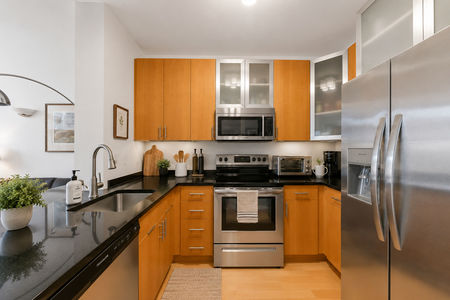 19. 26 Ave Port Imperial Bright and modern kitchen interior
