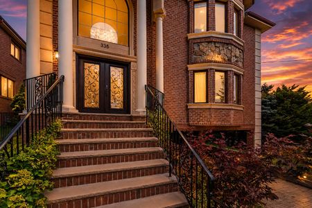 2. 335 Riverdale Elegant sunset at a grand entrance