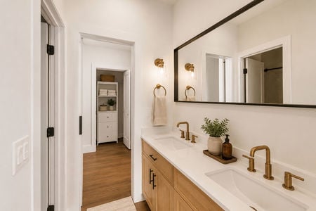 21. 67 E Clinton Minimalist Scandinavian bathroom with warm accents