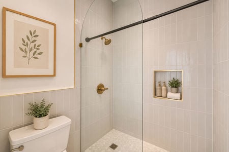 22. 67 E Clinton Modern minimalist bathroom with brass accents