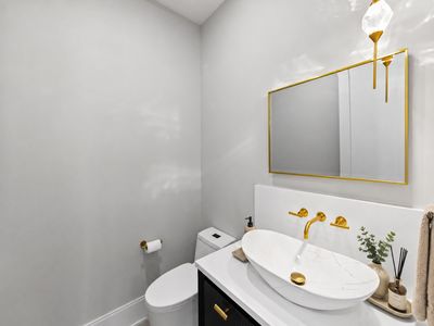 22.14 Allison Drive - Modern, minimalist bathroom in shades of gold