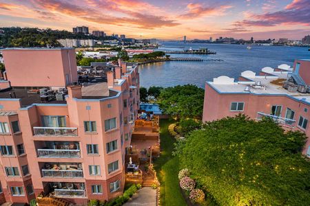 23. 303B Nelson Golden hour over riverside cityscape