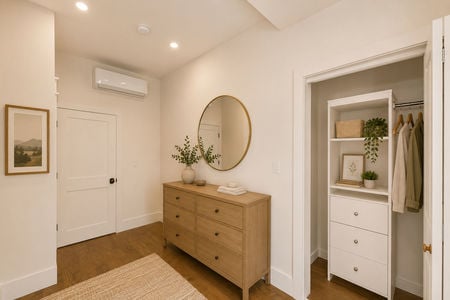 23. 67 E Clinton Warm minimalist bedroom corner with plants