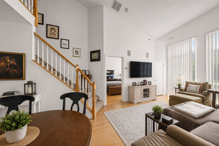 24.26 Ave Port Imperial Modern living room with open staircase