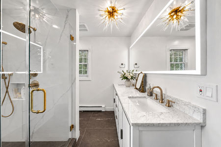 27. 5 Gates Pl. Luxurious gold-accented bathroom design